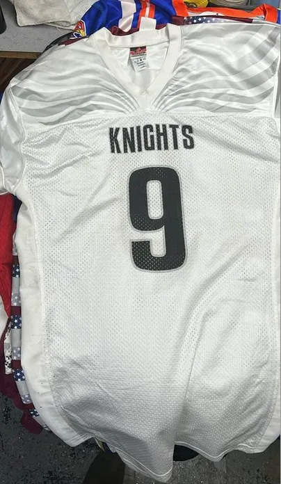 8 Assorted men’s football jerseys.