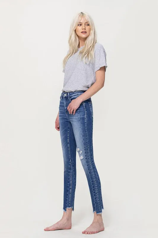 HIGH RISE ANKLE SKINNY WITH UNEVEN HEM DETAIL