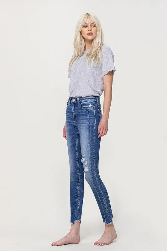 HIGH RISE ANKLE SKINNY WITH UNEVEN HEM DETAIL