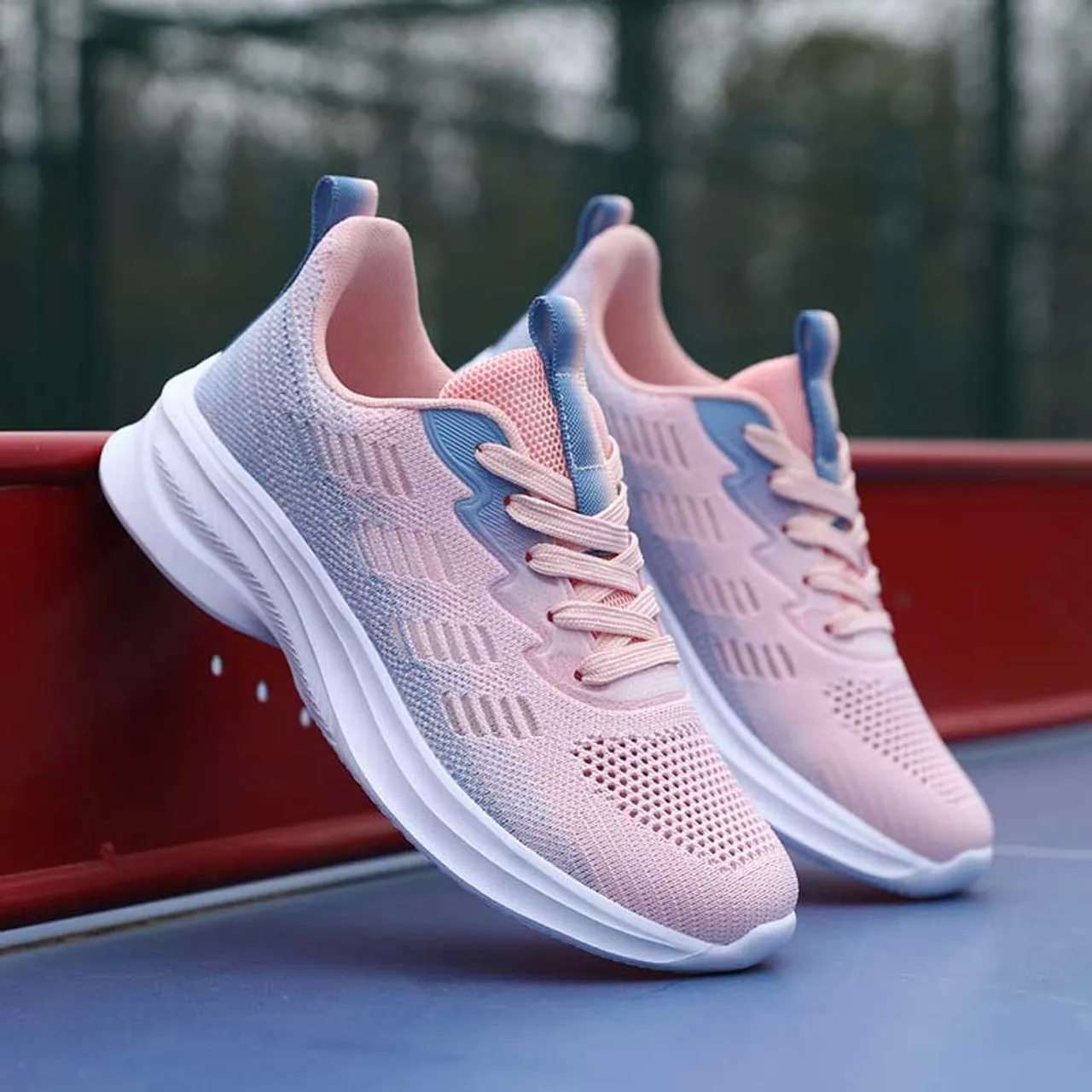 Pink flyknit stripe accents sport shoe sneaker