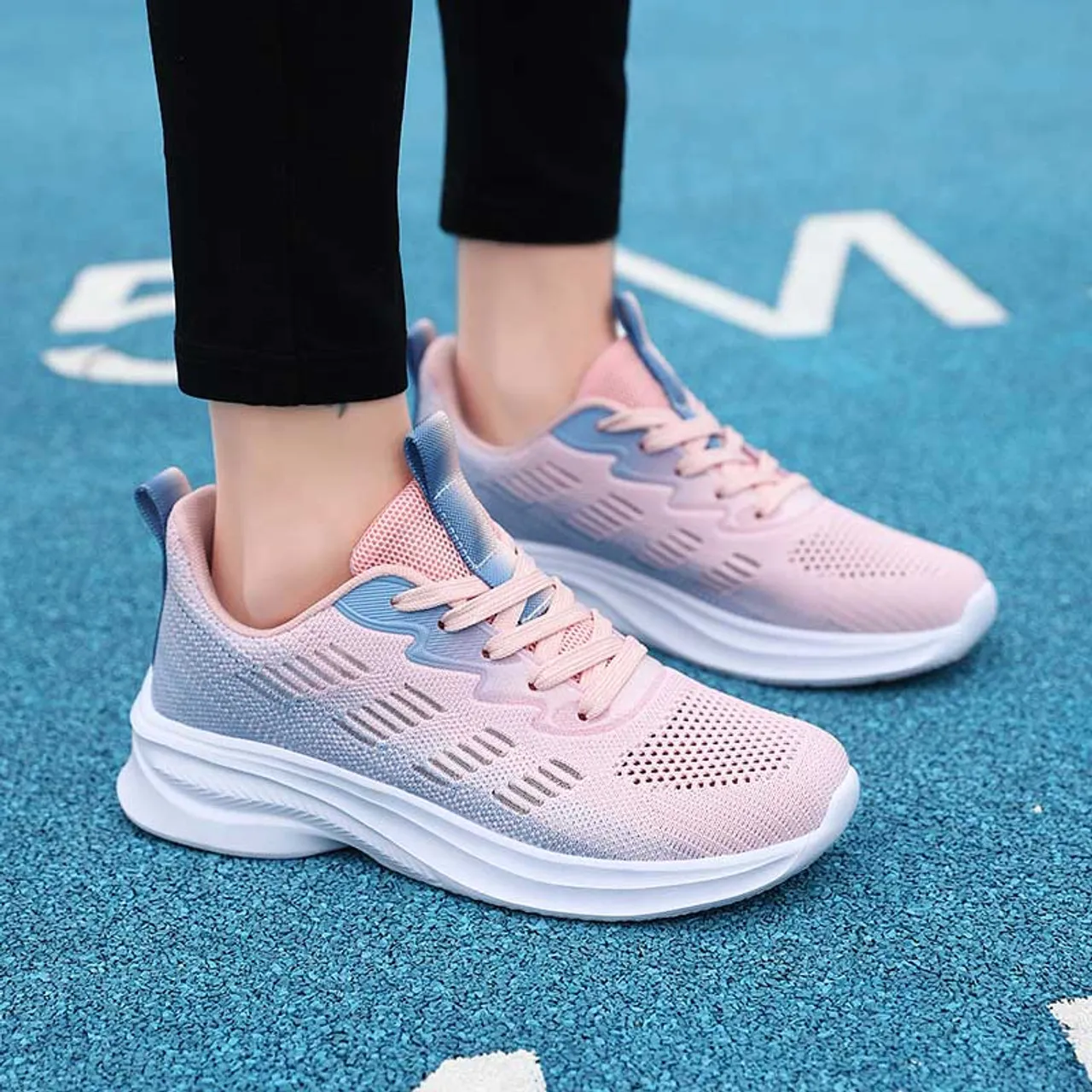 Pink flyknit stripe accents sport shoe sneaker