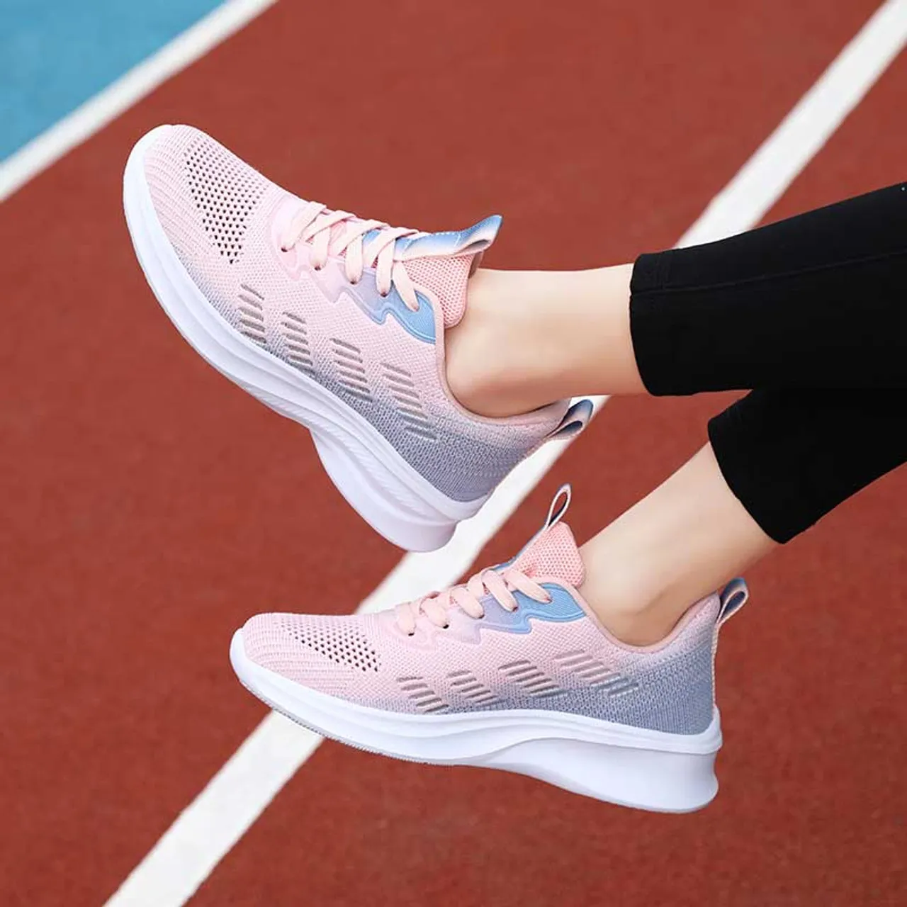 Pink flyknit stripe accents sport shoe sneaker