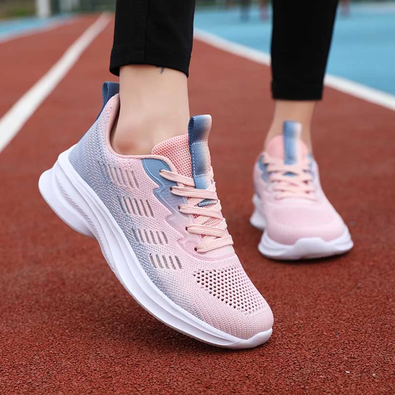 Pink flyknit stripe accents sport shoe sneaker