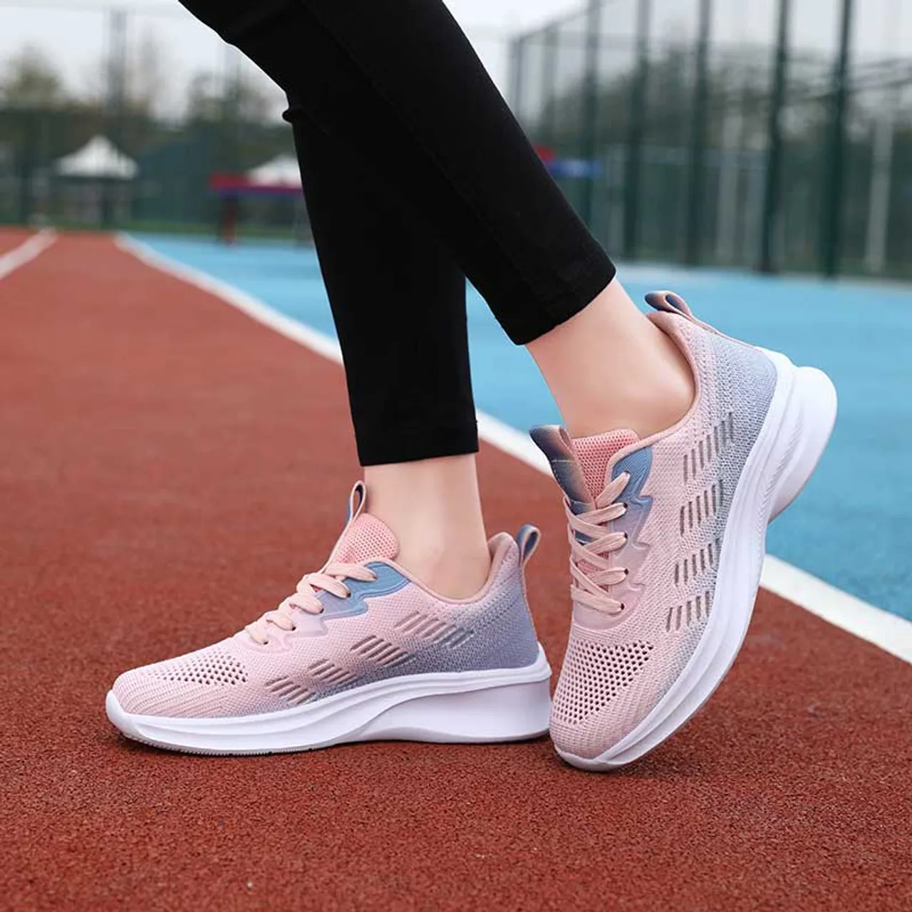 Pink flyknit stripe accents sport shoe sneaker