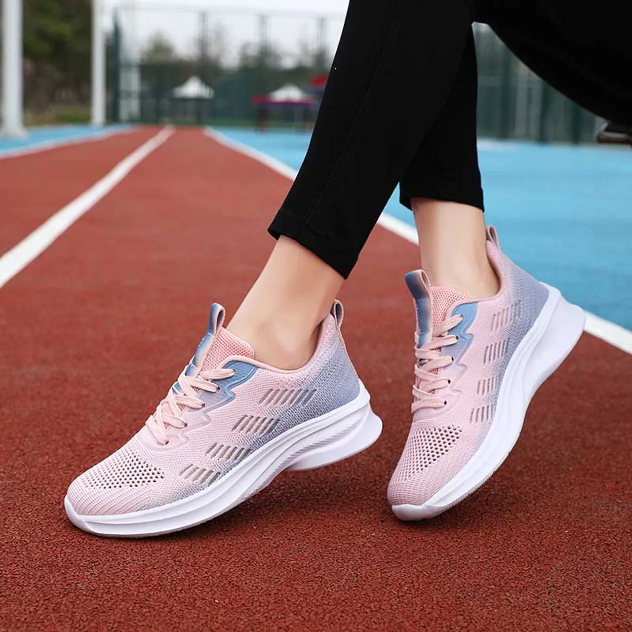 Pink flyknit stripe accents sport shoe sneaker