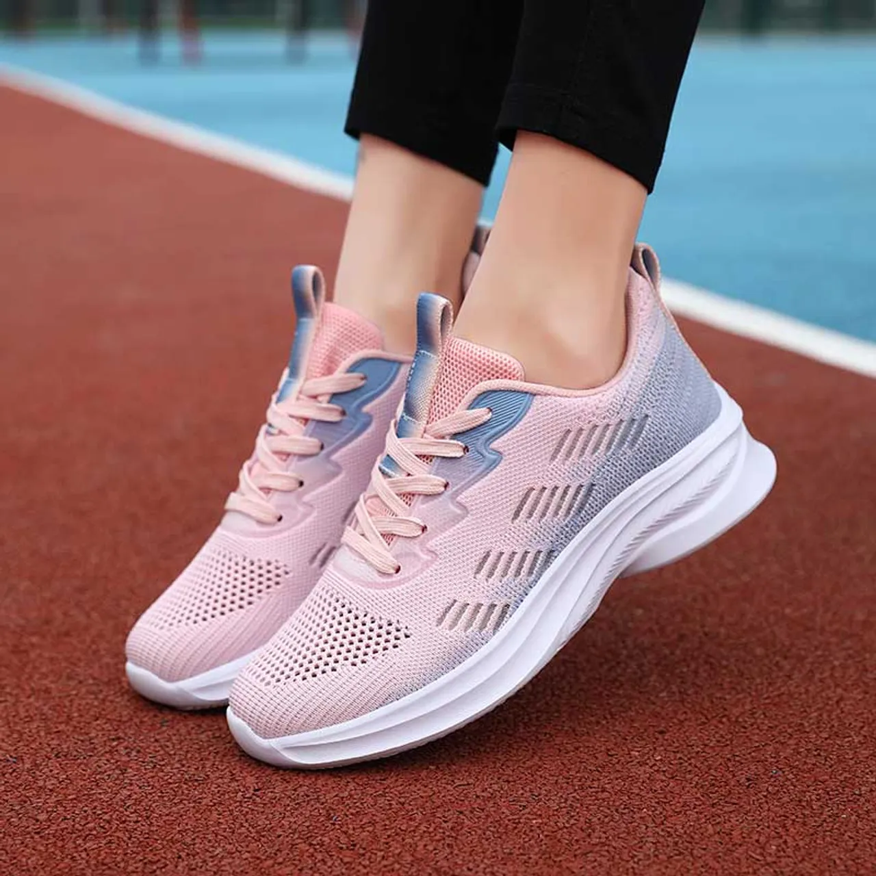 Pink flyknit stripe accents sport shoe sneaker